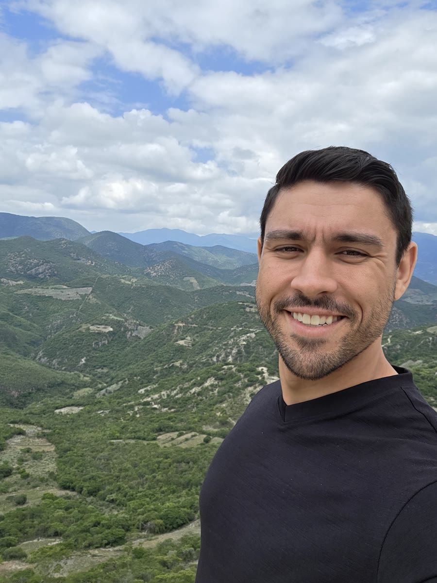 Devin McDermott smiling, a selfie in the mountains of Oaxaca